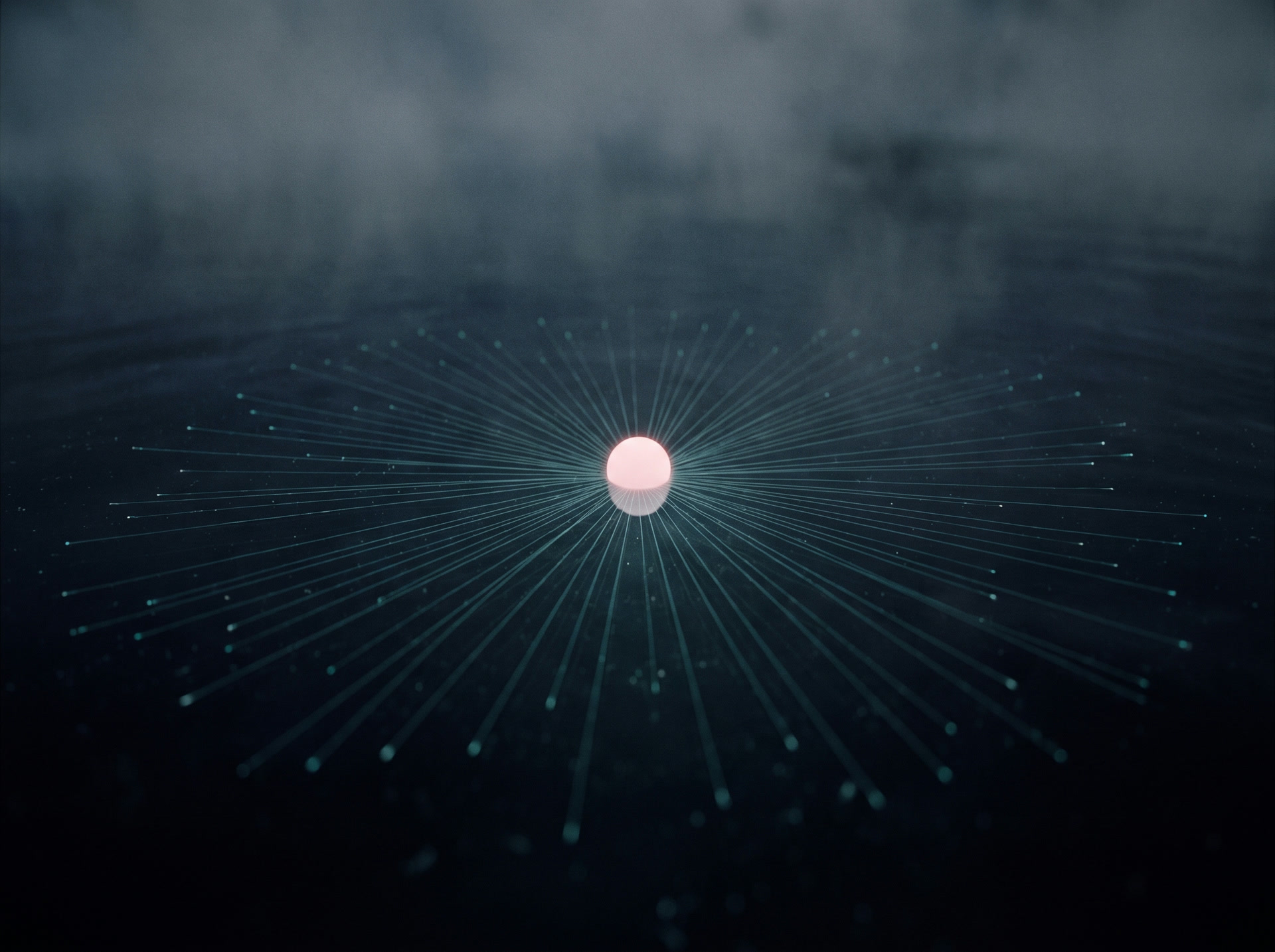 A single point of light spreading outward into many smaller lights